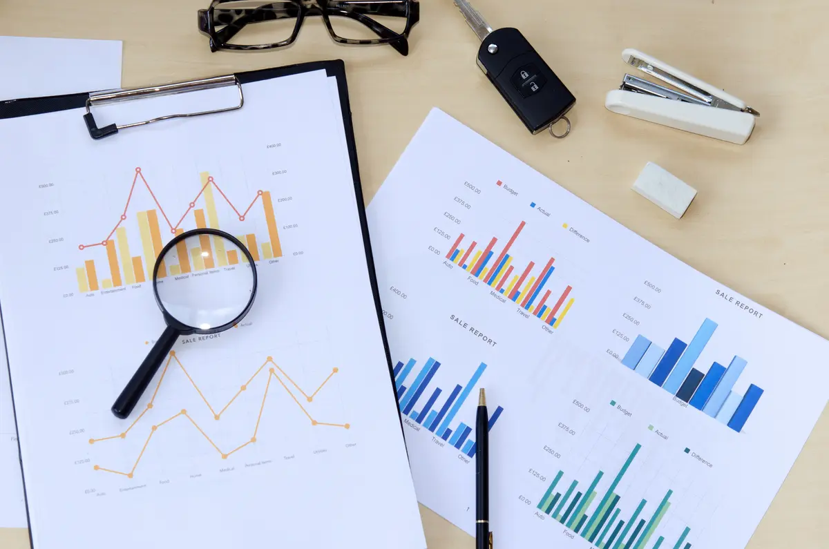 Financial reports and a calculator on a desk